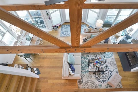 Beam Accents in vaulted ceilings over living room
