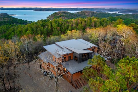 3 story custom built 5000sqft cabin with180 degree lake views & so much more!