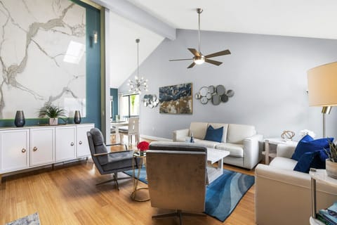 Living room with vaulted ceilings and unique artwork