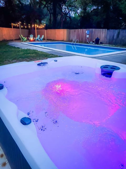 Entertaining backyard with hot tub, pool and fire pit.