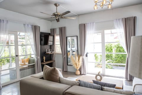 Modern, Bright living room retreat- Plush seating, stylish gray, Family-friendly