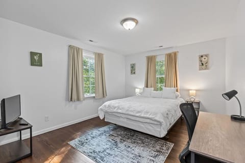 Experience unparalleled comfort on our luxurious queen-size mattress, accompanied by a Roku Smart TV for entertainment, blackout curtains for uninterrupted rest, a convenient workstation, and ample closet space for your belongings.