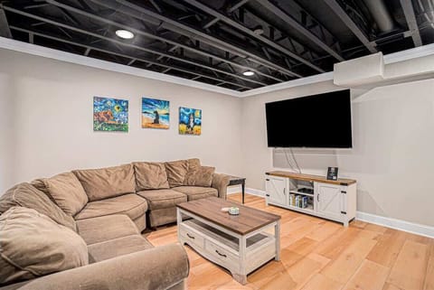 Excitement Awaits in the Lower Level Game Room, Equipped with a 70 Flat-screen TV Perfect for Movie Nights
