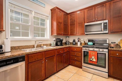 Indulge in Culinary Creativity with Our Home`s Spacious Countertops and Modern Appliances