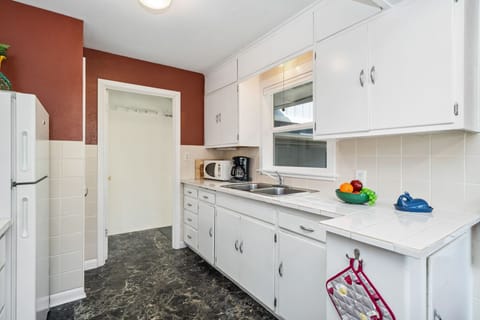 Fully equipped kitchen. Sorry no dishwasher. Open to dining room and access to the garage.