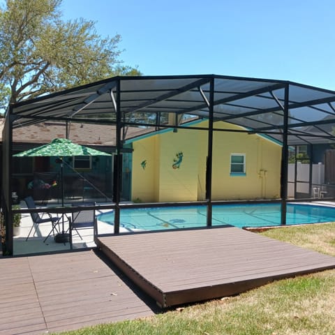 private screened swimming pool with sundeck