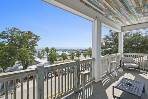 Step onto the balcony and immerse yourself in a scene of pure coastal allure. The tranquil harbor, dotted with graceful sailboats, stretches toward the shimmering expanse of the Gulf of Mexico. Near New Orleans, LA, Gulfport, MS, Biloxi, MS