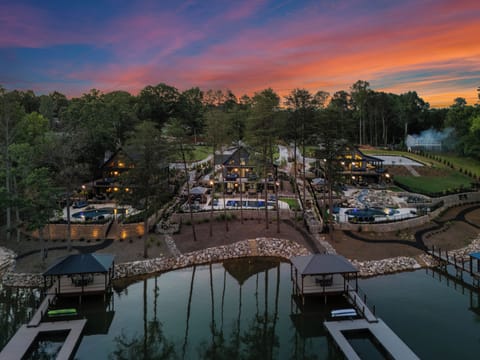 Aerial View of The Lodges from right to left: Gray Fox Lodge, Blue Heron Lodge and Black Bear Lodge. All have 6 bedrooms, 6.5 baths, movie theater, pool, hot tub & dock. 