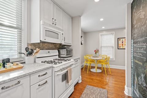 Your fully equipped kitchen with modern appliances and charming breakfast nook creates the perfect space for morning coffee and home-cooked meals.