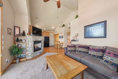 Cozy up in this inviting living area with stone fireplace, a perfect mountain getaway. The queen sleeper sofa provides extra sleeping space for the kids.