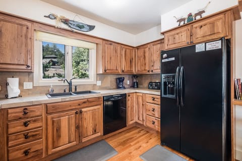 The spacious kitchen has a full size refrigerator
