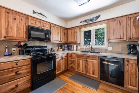 Gorgeous kitchen with wooden features, dishwasher, microwave