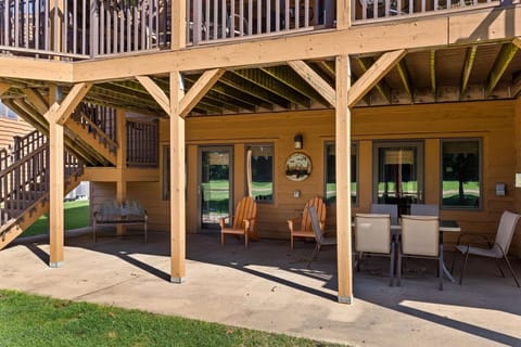 Large covered patio perfect for golf-watching, dining, grilling, cornhole, etc. 