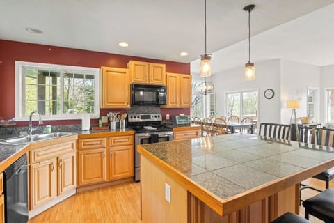 Step into this inviting kitchen, complete with ample counter space and modern fixtures, seamlessly blending functionality with style for your culinary adventures. 