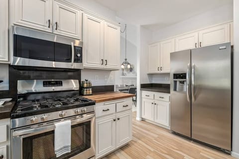 Wood block counter section. Bar area. Fridge with ice maker and filtered water.