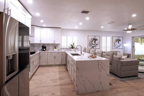 This open floor plan offers a seamless flow, fostering a sense of connectivity throughout the entire living area.