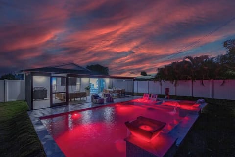 533 Posh Paradise; Where radiant hues reflect in the tranquil waters as the sun bids farewell