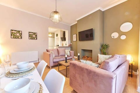 Make yourself at home in our living room haven, where chairs beckon, natural light dances, and beautiful pictures adorn the walls