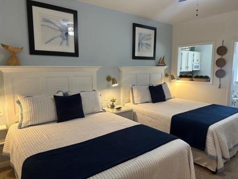 New Queen beds and custom made headboards, USB charging connection on nightstand