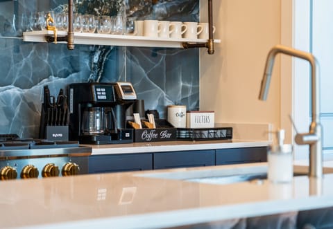 There is a Coffee Bar Set Up at the End of the Counter As Well with a Dual Style Coffee Maker