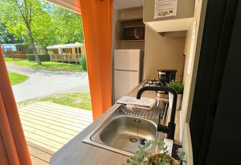 Compact and convenient, this kitchenette brings the outdoors in, making it easy to prepare snacks and meals while staying connected to nature.