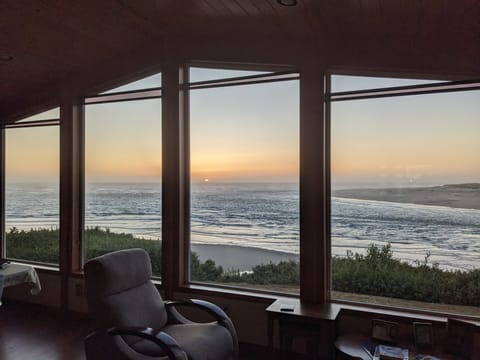 Picture windows in living room at sunset