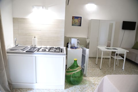 Family Quadruple Room, Courtyard View | Private kitchen | Full-size fridge, stovetop, espresso maker, coffee/tea maker