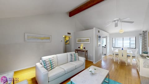 Living room, with ceiling fan, a/c, and HDTV