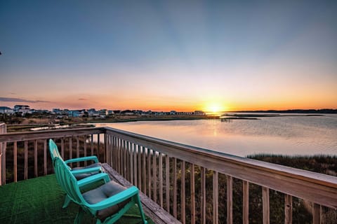 Experience breathtaking sunsets from this deck overlooking tranquil waters. A serene spot to relax and take in the beauty of nature.