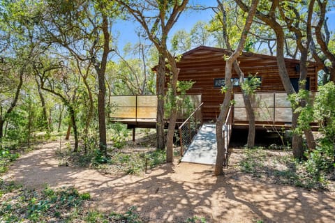 Dripping Springs treehouse vacation rental with heated pool and firepit - unique Hill Country experience 30 minutes from Austin, TX