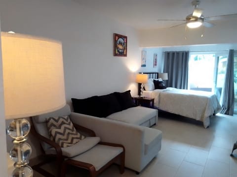 Queen size bed plus queen size sofa bed in living room and rocking chair