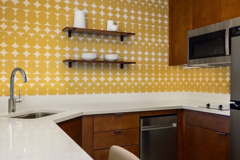 Suite, 1 Bedroom | Private kitchen | Full-size fridge, microwave, stovetop, dishwasher