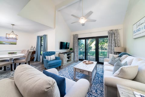 The comfortable great room with vaulted ceilings and large sliding doors to the large deck.