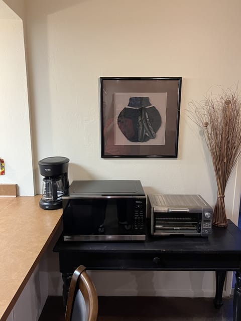 Brand new microwave, Breville toaster oven, and drip coffee maker.