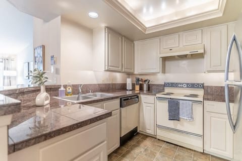 The kitchen, designed for functionality and togetherness, provides ample space for meal preparation