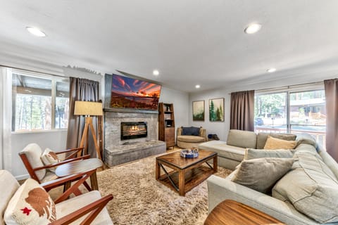 Sink into plush sectional seating by your cozy fireplace, where mountain views and warm ambiance create perfect moments for relaxation.