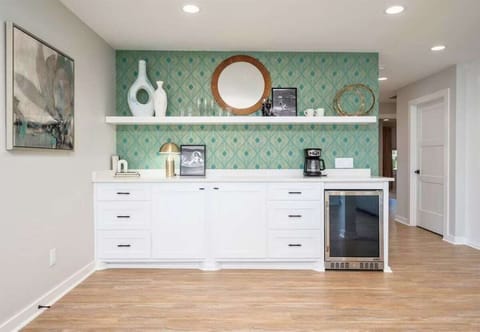 This bar area is a fantastic addition to the kitchen, making it easy to serve refreshments during gatherings.