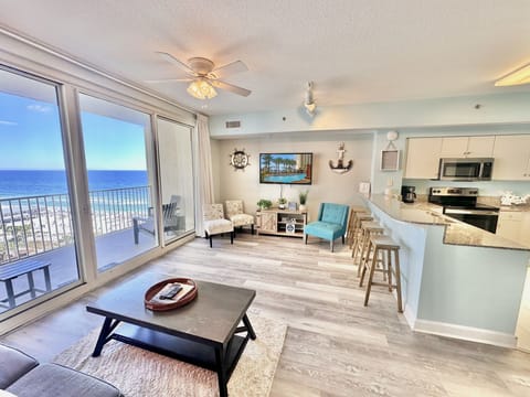 Comfortable beachfront living space with Smart TV and sleeper sofa — relax after beach days.