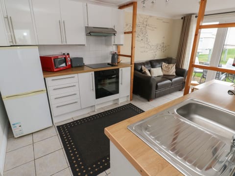 Fridge, electric kettle, cookware/dishes/utensils