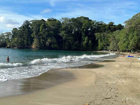 Beach nearby, black sand, beach towels