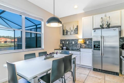 Breakfast bar with seating for five, ideal for quick snacks or morning coffee.