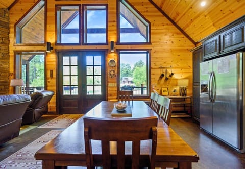 Gather around the spacious kitchen table for hearty meals and laughter, all with a stunning backdrop of the lake.