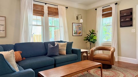 Bright, stylish living room with natural light and cozy seating