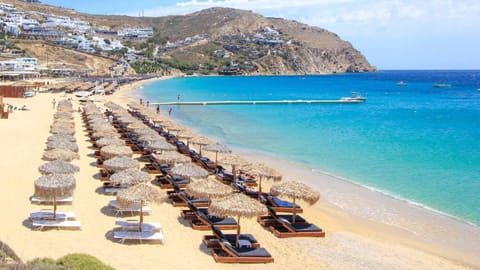 Beach nearby, white sand, sun loungers, beach umbrellas