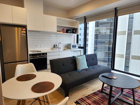 City Apartment | Living area | 50-inch LED TV with satellite channels