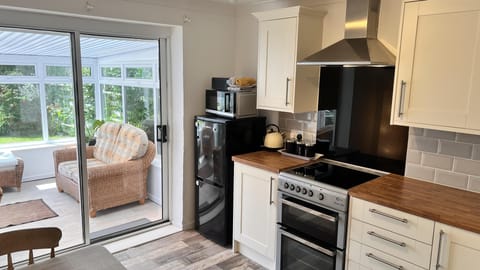 Well equipped kitchen with single oven, hob, fridge freezer and plenty of cutlery, crockery, utensils, pots, pans etc. Toaster, Microwave, kettle, bluetooth radio.