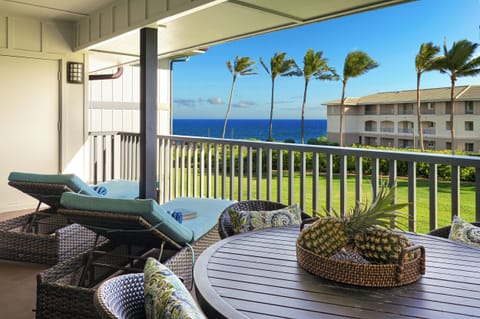 DOWNSTAIRS COVERED LANAI WITH PARTIAL OCEAN VIEW
