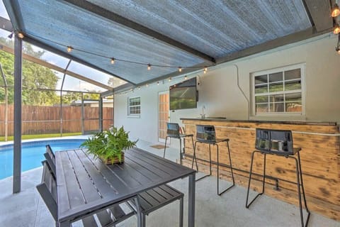 Stir up some drinks or watch the flat-screen TV at the outdoor bar and dining area in the back yard.