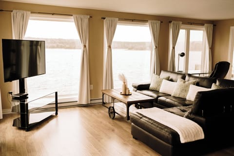 Panoramic Suite, Ocean View | Living area | 42-inch LCD TV with cable channels, streaming services
