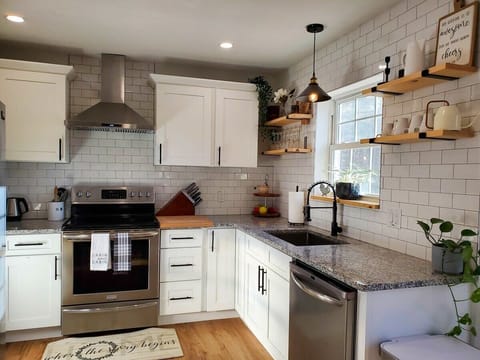 Chef's kitchen is fully equipped with everything you may need-stainless steel appliances, toaster, kettle, blender, hand mixer, pots&pans, spices and some pantry items